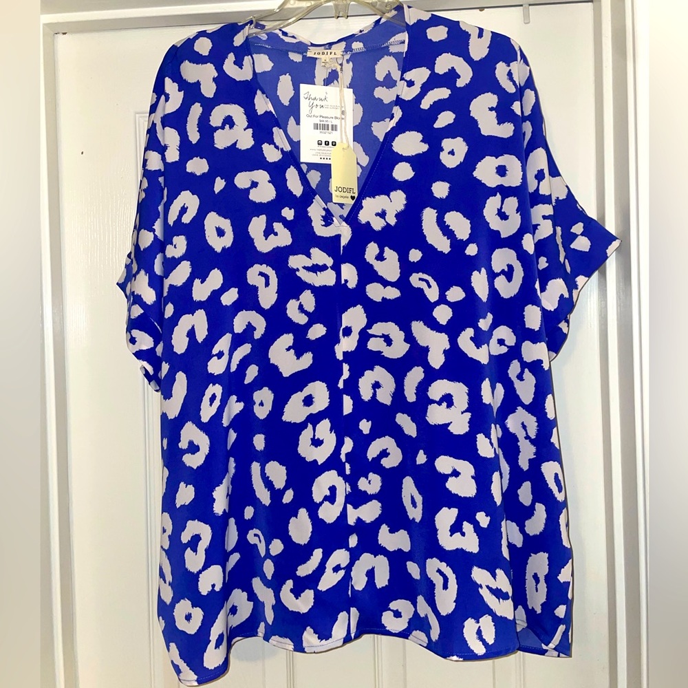 NWT. Women’s size Large JODIFL V-neck blouse. Color is blue/purple. Stunning!